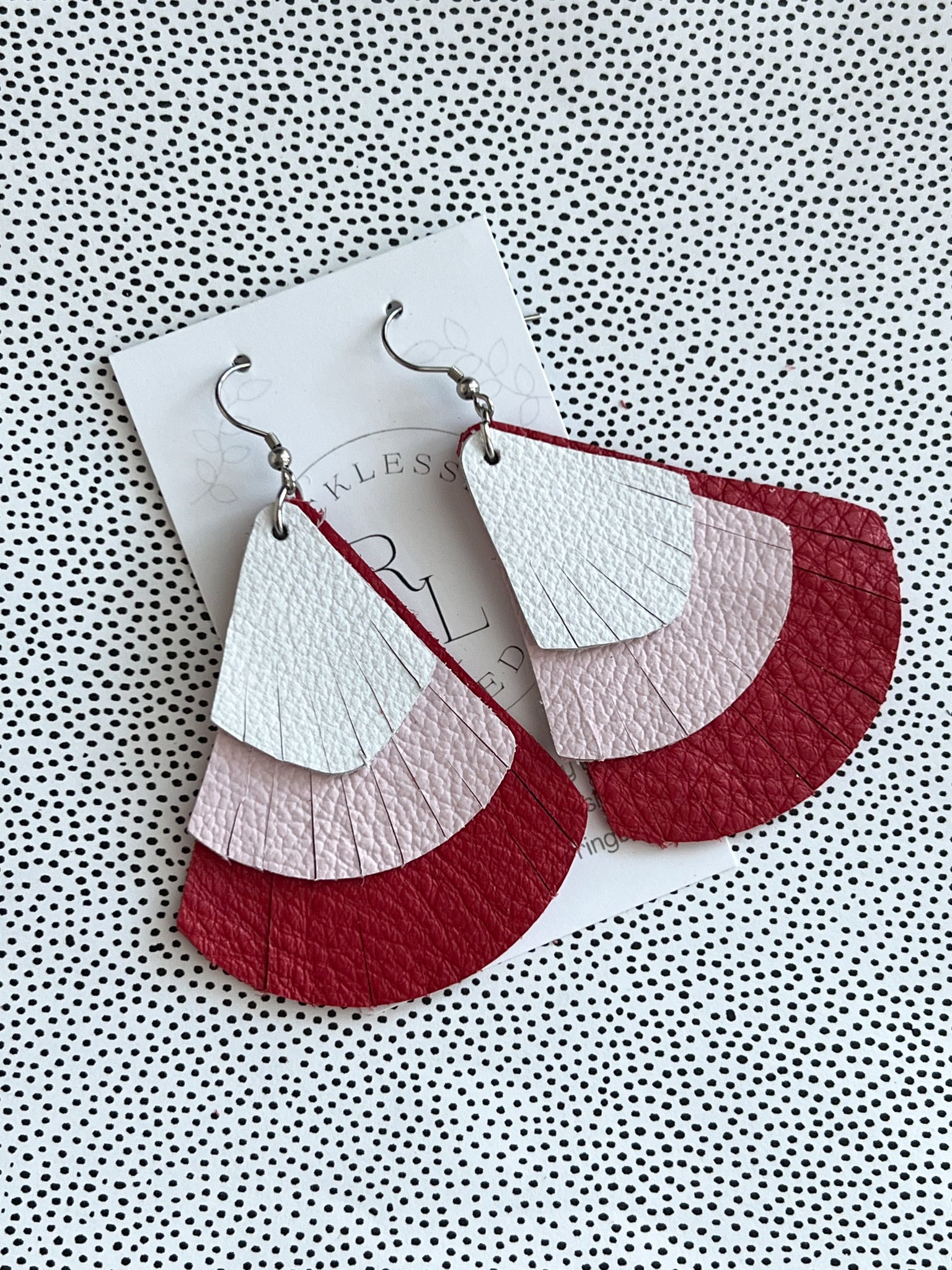 White, pink and red fringed fan